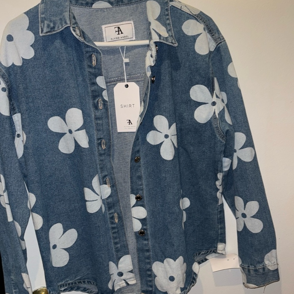 “Flying Angel” denim flowered jacket.